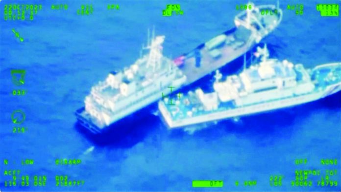 ship_resized THIS IMAGE released by the Armed Forces of the Philippines shows a Chinese militia vessel (top) and Philippine coast guard vessel BRP Cabra as they approach Second Thomas Shoal, locally called Ayungin Shoal, at the disputed South China Sea on Sunday, Oct. 22, 2023. Armed Forces of the Philippines via AP