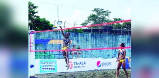 University of Santo Tomas Golden Tigresses’ Genesa Eslapor and Sophia Pagara in action during the 1st Mayor Albee Benitez Beach Volleyball Tournament. PHOTO COURTESY OF PAUL JAN DOLOIRAS