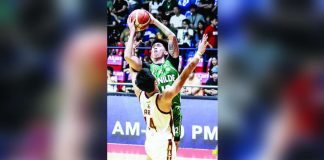 Negrense Miggy Corteza of the College of St. Benilde Blazers goes for a tough basket against a University of Perpetual Help Altas defender. PHOTO BY NCAA/GMA SPORTS