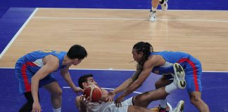 Gilas Pilipinas’ Chris Newsome and Calvin Oftana try to steal the ball from a fallen Iranian player. PHOTO COURTESY OF PSC-POC MEDIA POOL