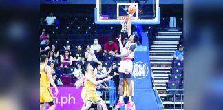 University of the East Red Warriors center Precious Momowei rises up for the rebound. UAAP PHOTO