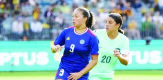 Filipinas’ Reina Bonta tries to block Australia’s Sam Kerr during their 2024 AFC Women’s Olympic Qualifying Tournament game on Sunday night at the Optus Stadium in Australia. PHOTO COURTESY OF PFF