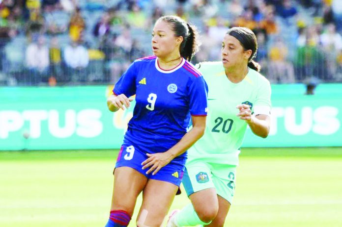 Filipinas’ Reina Bonta tries to block Australia’s Sam Kerr during their 2024 AFC Women’s Olympic Qualifying Tournament game on Sunday night at the Optus Stadium in Australia. PHOTO COURTESY OF PFF