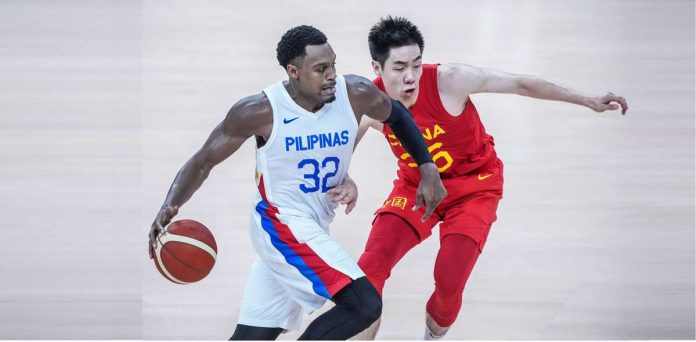 sports_gilas_resized Justin Brownlee tackles a Chinese player during the 19th Asian Games men’s basketball tournament in Hangzhou, China. PHOTO COURTESY OF POC-PSC MEDIA GROUP