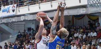 Iloilo United Royals’ Conrad Catapusan attacks the defense of Bacoor City Strikers’ Jammer Jamito. MPBL PHOTO