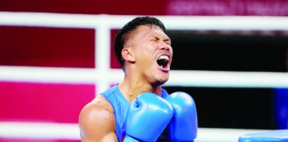 Filipino boxer Eumir Marcial reacts after bowing to China’s Tanglatihan Tuohetaerbieke in the19th Asian Games men’s 80-kilogram gold medal match last night at the Hangzhou Gymnasium in China. PHOTO COURTESY OF AIJAZ RAHI/AP