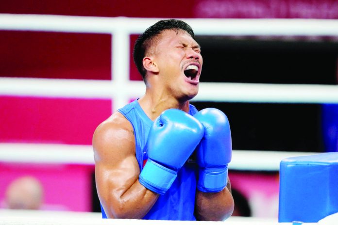 sports_marcial_resized Filipino boxer Eumir Marcial reacts after bowing to China’s Tanglatihan Tuohetaerbieke in the19th Asian Games men’s 80-kilogram gold medal match last night at the Hangzhou Gymnasium in China. PHOTO COURTESY OF AIJAZ RAHI/AP