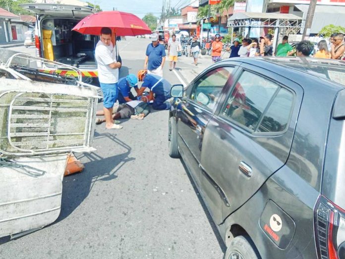 A tricycle crashed against a parked car on Mabini Street, Zone 1, Talisay City, Negros Occidental on Monday, Nov. 27. The driver and his passenger were injured. RADYO BANDERA TALISAY CITY, NEGROS OCCIDENTAL PHOTO