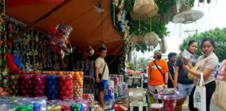 The Department of Labor and Employment reminds employers to release the 13th month pay of qualified employees in the private sector on or before Dec. 24, 2023. Photo shows people buying Christmas decorations as early as October this year. CONTRIBUTED PHOTO