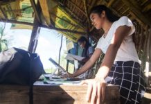 Danica Maanad and Arlotz Lacao of Suluan Island, Eastern Samar review their notes from the previous distance learning session prior their class in this file photo. ALREN BERONIO, ABS-CBN NEWS/FILE PHOTO