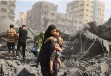 ‘Gaza fast becoming a graveyard for children’ A Palestinian woman secures her child amid the rubbles of a residential building destroyed by Israeli airstrike in the Gaza Strip. GETTY IMAGES
