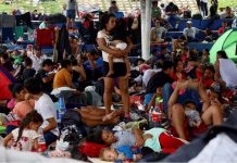 Migrant caravan heading to US grows in numbers Migrants traveling in a caravan rest before continuing their journey through Mexico in an attempt to reach the USborder, in Huixtla, Mexico. REUTERS