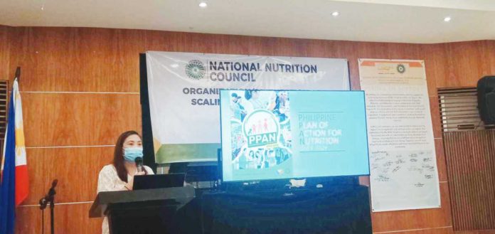 Sheryl C. Sedantes, officer-in-charge Regional Nutrition Program Coordinator of the National Nutrition Council Region 6, presents the Philippine Plan of Action for Nutrition 2023-2028 on Tuesday morning, Nov. 21. PN PHOTO