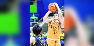 University of Santo Tomas Growling Tigers’ Paul Manalang pulls up for a basket against the defense of Far Eastern University Tamaraws’ Xyrus Torres. UAAP PHOTO