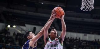 Negrense Mark Nonoy of De La Salle University Green Archers was fouled by a National University Bulldogs player as he goes for a basket. UAAP PHOTO
