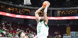 De La Salle University Green Archers’ Bright Nwankwo attempts a two-handed dunk against a Far Eastern University Tamaraws defender. UAAP PHOTO