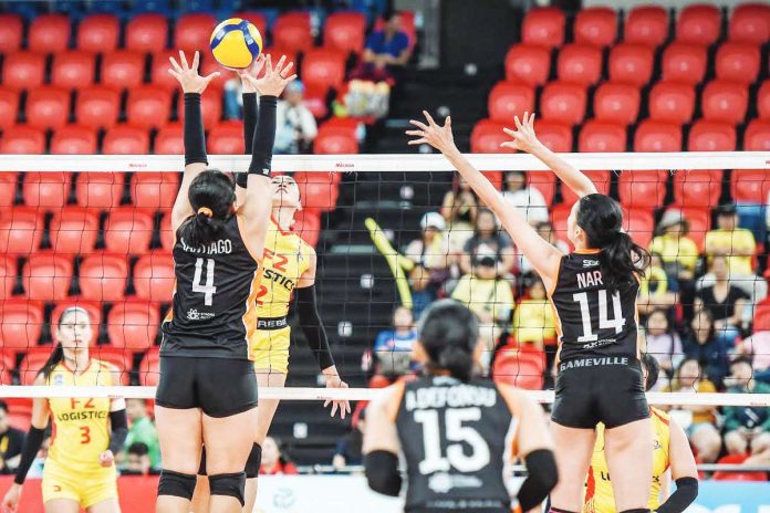 sports_F2_resized llongga Abigail Marano of F2 Logistics Cargo Movers scores against the defense of Farm Fresh Foxies’ Kate Santiago. PVL PHOTO