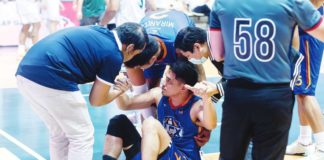 Kevin Alas is assisted by members of the NLEX Road Warriors following a knee injury during their game against Terrafirma Dyip. PHOTO COURTESY OF NLEX ROAD WARRIORS