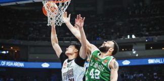 University of the Philippines Fighting Maroons’ Sean Torculas and De La Salle University Green Archers’ Ben Phillips battle for the rebound. UAAP PHOTO