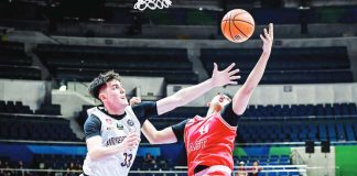 University of the Philippines Fighting Maroons’ Sean Alter foils the shot of University of the East Red Warriors’ Ethan Galang. UAAP PHOTO