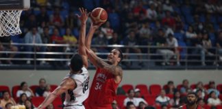 Barangay Ginebra San Miguel Kings' Christian Standhardinger attacks the defense of Blackwater Bossing's Jeth Troy Rosario for an inside hit. PBA PHOTO