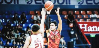 Mapua University Cardinals’ Clint Escamis drills a three-pointer against a University of Perpetual Help Altas defender. PHOTO COURTESY OF NCAA/GMA SPORTS
