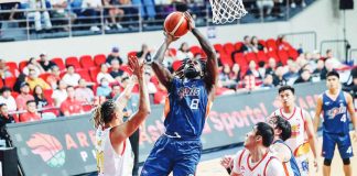 Meralco Bolts’ Suleiman Braimoh attacks the defense of Rain or Shine Elasto Painters’ Keith Datu and Rey Mark Belo for an inside hit. PBA PHOTO