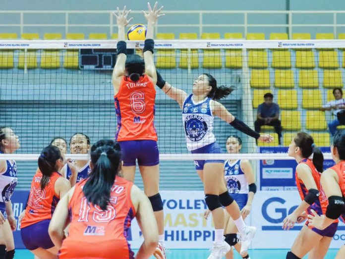 sports_negros_resized Negros ICC Blue Hawks’ Angel Mae Habacon attempts to score against Nasipit Lady Spikers’ Janeth Tulang. MPVA PHOTO