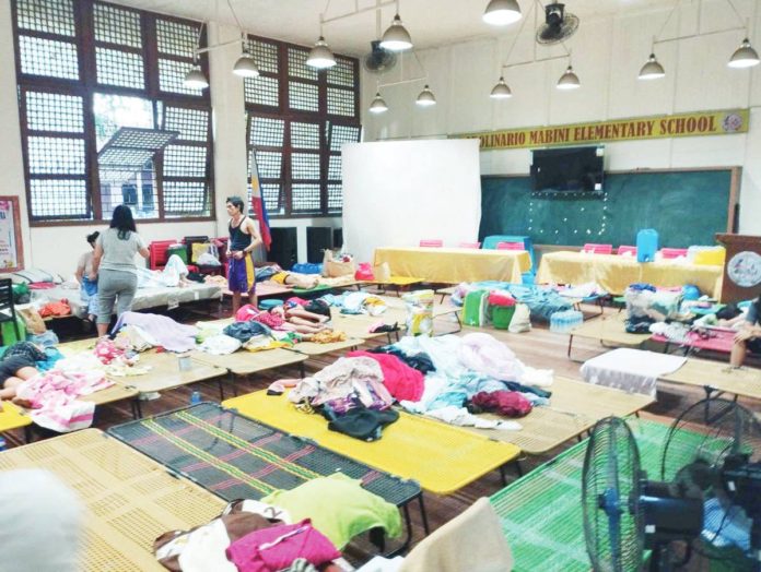 Bacolod_fire_evac_resized Fire victims in Barangay 29, Bacolod City seek temporary shelter at Apolinario Mabini Elementary School. MAE SINGUAY/PN