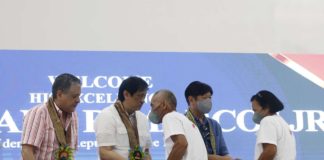 Two agrarian reform beneficiaries receive Certificates of Land Ownership Awards during the distribution led by President Ferdinand Marcos Jr. in Passi City, Iloilo on Monday, Dec. 11. PNA PHOTO BY ALFRED FRIAS