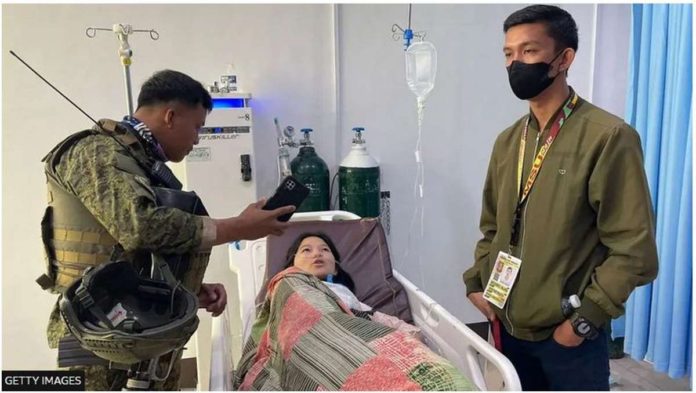 IS.JPG_resized Soldiers interview a survivor of the bombing at the Mindanao State University in Marawi City on Dec. 3, 2023. GETTY IMAGES