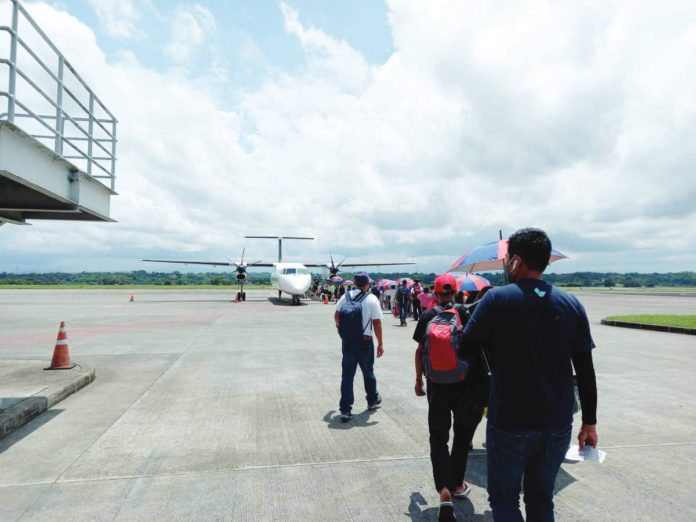 Passengers line up to board an airplane at the tarmac of the Iloilo Airport in Cabatuan town. The airport recorded passenger arrivals of 2,550 and departures of 2,876 in a single day in September this year. PEARL SOCIAS PHOTO