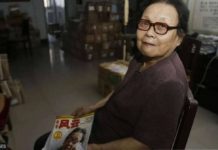 Dr. Gao Yaojie holds a magazine which features her in the cover. She refused to keep quiet about the spread of HIV in China. GETTY IMAGES