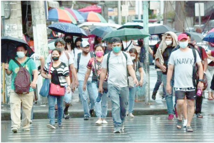 The Department of Health recommends continued wearing of face masks as a precaution against a spike in COVID-19. INQUIRER FILE PHOTO
