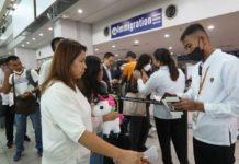 Passengers line up at an immigration counter at the Ninoy Aquino International Airport Terminal 3 in Pasay City. PNA FILE PHOTO