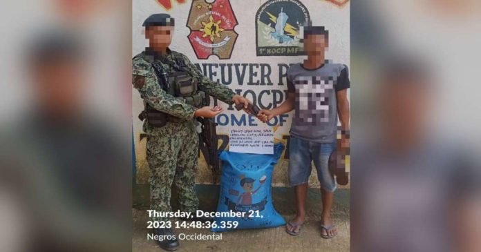 formet CTG_superimposed A former New People’s Army rebel turned over a firearm following his voluntary surrender to authorities in Don Salvador Benedicto, Negros Occidental. PRO-6 PHOTO
