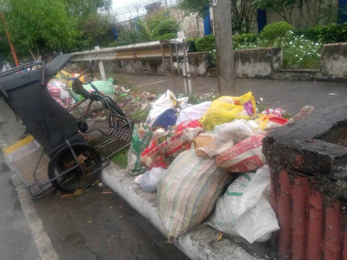 garbage The Iloilo City Environment and Natural Resources Office collected garbage on San Pedro Street in City Proper district on Dec. 25. NEIL RAVENA PHOTO