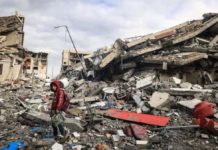 ‘Untreated diseases could kill more than bombings in Gaza’ A Palestinian boy walks past destroyed buildings in the central Gaza Strip. AFP