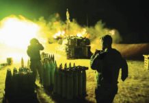 Israel ‘encircles’ Hamas strongholds An Israeli Defense Force artillery unit fires towards Gaza Strip near the border in southern Israel. GETTY IMAGES