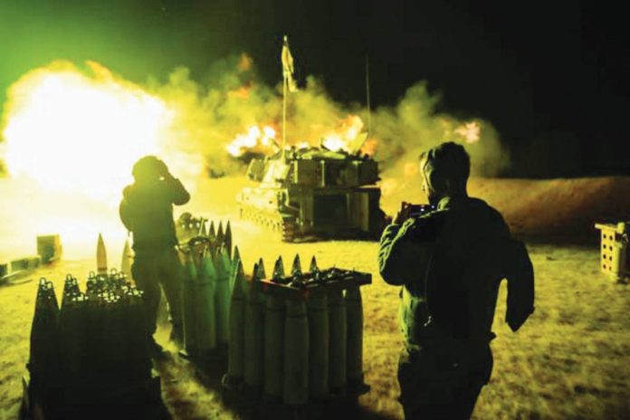 gaza_resized An Israeli Defense Force artillery unit fires towards Gaza Strip near the border in southern Israel. GETTY IMAGES