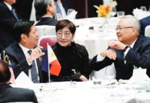 President Ferdinand Marcos Jr. speaks with Tetsuro Tomita, chair of the Board of Councillors of Keidanren (Japan Business Federation), at the 50th anniversary of the Asean-Japan Friendship and Cooperation luncheon meeting in Tokyo, Japan, on Dec. 18, 2023. REUTERS PHOTO