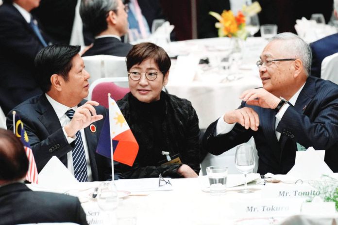 job_ops_resized President Ferdinand Marcos Jr. speaks with Tetsuro Tomita, chair of the Board of Councillors of Keidanren (Japan Business Federation), at the 50th anniversary of the Asean-Japan Friendship and Cooperation luncheon meeting in Tokyo, Japan, on Dec. 18, 2023. REUTERS PHOTO