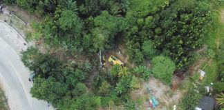This drone shot shows the “killer curve” in Barangay Igbucagay, Hamtic, Antique where the Ceres bus overshot a concrete barrier and plunged into a ravine on Dec. 5, 2023. MELMAR DELA CRUZ/K5 NEWS FM ILOILO PHOTO