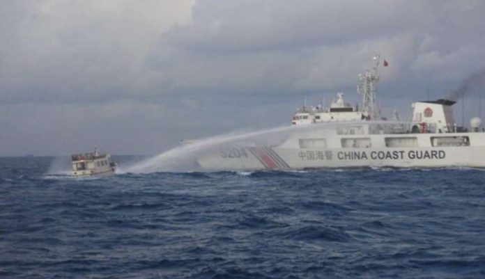 manila_resized A Chinese military vessel fires a water cannon at Philippine boat M/L Kalayaan during a resupply mission in Ayungin (Second Thomas) Shoal in the West Philippine Sea on Dec. 10, 2023. The boat had to be towed back to port without completing its mission due to significant damage from the attack. PHOTO FROM PCG