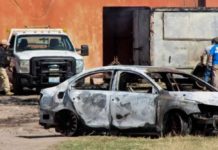 Mexican gunmen kill 12 at Christmas celebration The burnt wreckage of a car stands at the scene where members of an armed group opened fire to partygoers attending a posada, in Salvatierra, in Guanajuato state, Mexico. REUTERS
