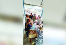 OCD-6 warns of potential floods, landslides due to tropical depression Personnel of the Philippine Coast Guard Auxiliary's 618th Squadron serve hot food and drinking water to stranded passengers at the BREDO Port in Bacolod City on Monday afternoon, Dec. 17. PCG-NEGROS OCCIDENTAL PHOTO
