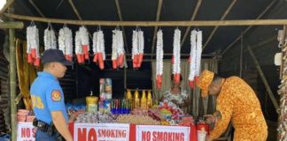 Bureau of Fire Protection personnel in Passi City, Iloilo inspect sellers of firecrackers at the designated area in Barangay Poblacion Ilawod on Thursday, Dec. 28. BFP R6 PASSI CITY FA FB PAGE PHOTO
