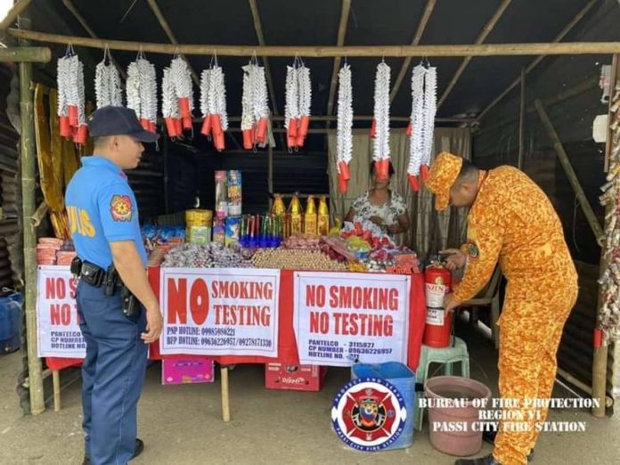 pyro_sale_resized Bureau of Fire Protection personnel in Passi City, Iloilo inspect sellers of firecrackers at the designated area in Barangay Poblacion Ilawod on Thursday, Dec. 28. BFP R6 PASSI CITY FA FB PAGE PHOTO