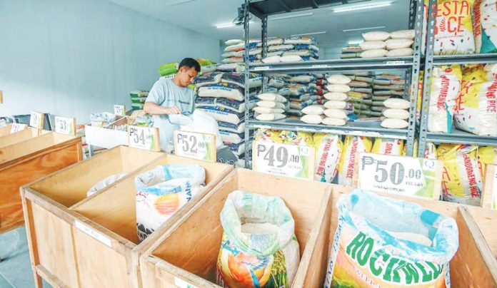 rice_supply.JPG_resized A worker arranges sacks of rice at a local rice store in Quezon City in this file photo. MARIA TAN, ABS-CBN NEWS/FILE PHOTO