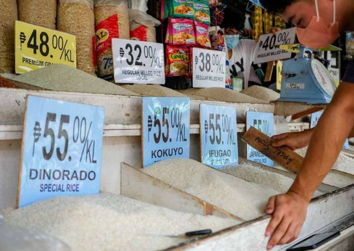 rice_vouchers.JPG_resized A market vendor waits for customers in front of their rice and grains store inside public market in Quezon City. GEORGE CALVELO, ABS-CBN NEWS/FILE PHOTO